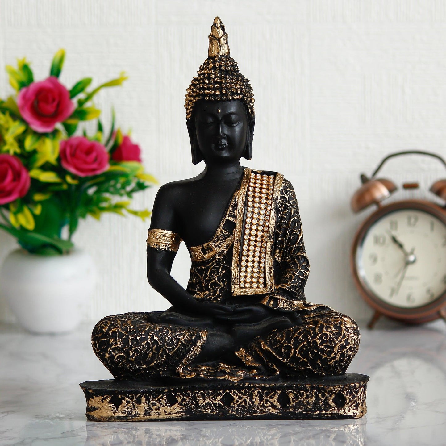 Handcrafted eCraftIndia Black and Golden Meditating Lord Buddha showpiece, ideal for enhancing tranquility and elegance in home or office spaces.